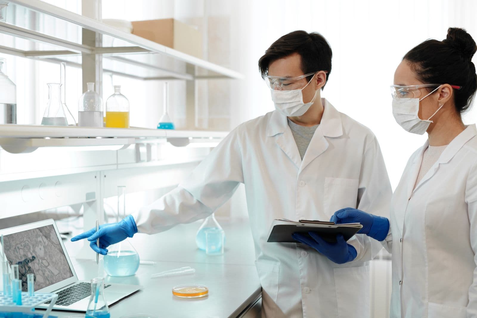Researchers reviewing scientific data in a laboratory setting